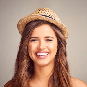 Smiling woman showing bright results after teeth whitening in Discovery Bay