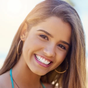 Teeth whitening in Brentwood close-up of a smiling woman showing bright white teeth